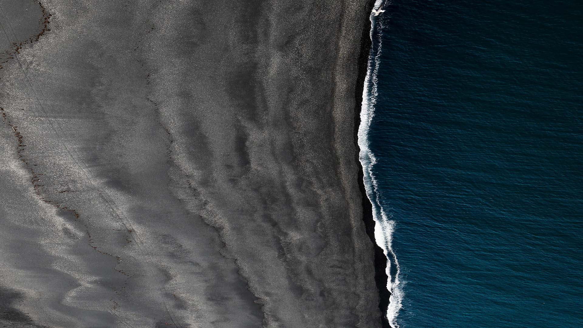 Resand_Aerial_View_Dark_Sand_Beach_16_9-1