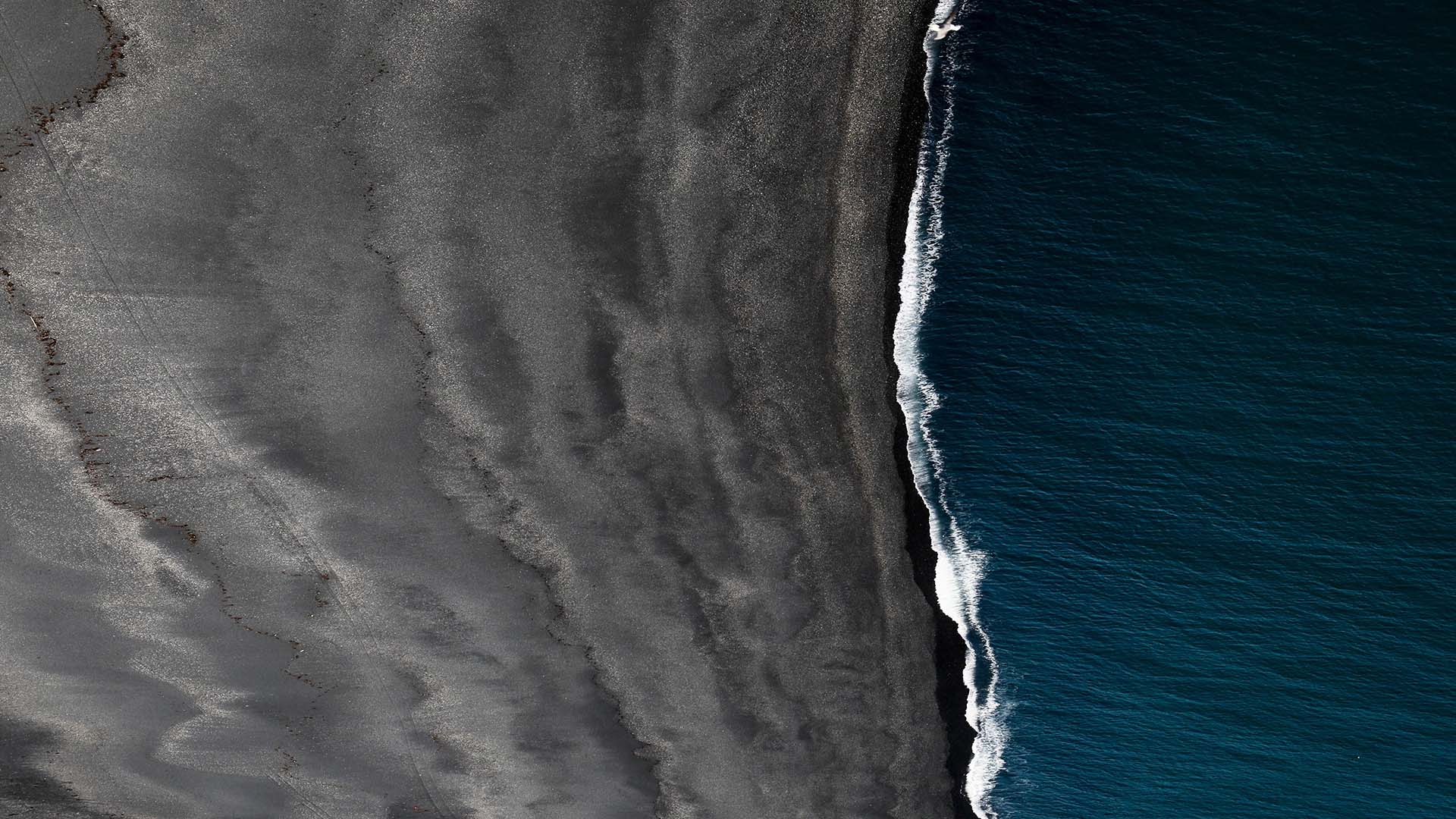 Resand_Aerial_View_Dark_Sand_Beach_16_9-1